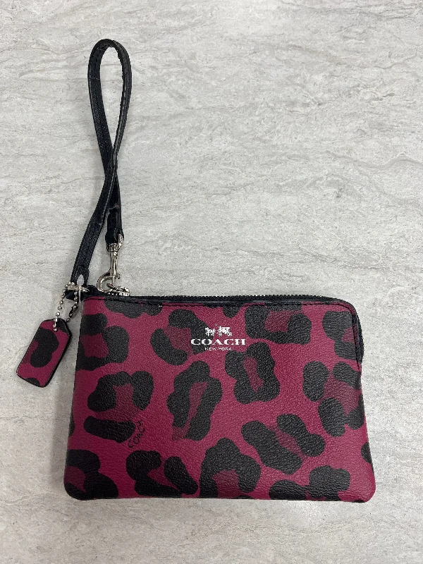 Coach Dempsey bags with a contrast - colored interior for visual interestWristlet Designer By Coach, Size: Small