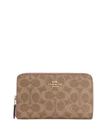 Coach Rogue bags with a monogram - embossed leather surfaceCoach Medium Id Zip Wallet In Signature Canvas