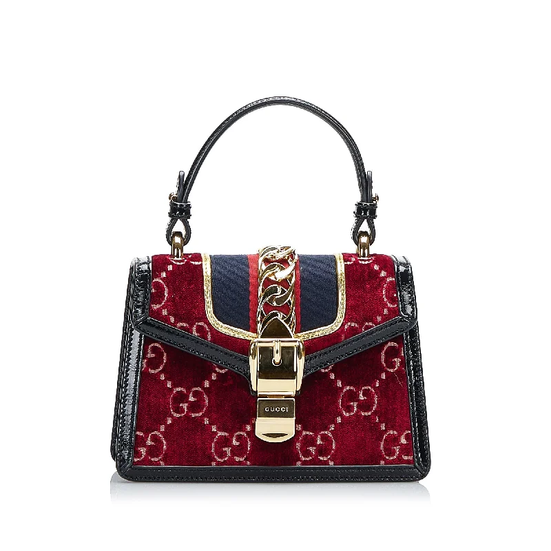 Women Gucci bags with a snap - button closure and a decorative charmGucci Sylvie Mini Red Velvet