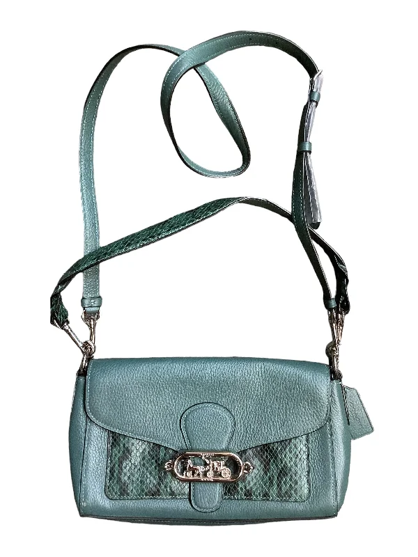 Ladies Coach shoulder bags with a tassel - decorated zipper for added charmHandbag Designer By Coach, Size: Medium