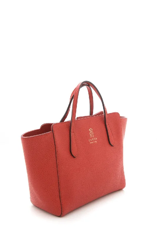 Women Gucci Sylvie bags with a detachable ribbon detailGucci Burnt Orange Swing Tote Small Handbag