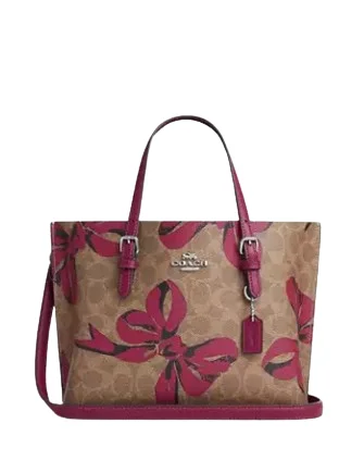 Coach tote bags with a printed Coach logo for brand visibilityCoach Mollie Tote Bag 25 In Signature Canvas With Bow Print