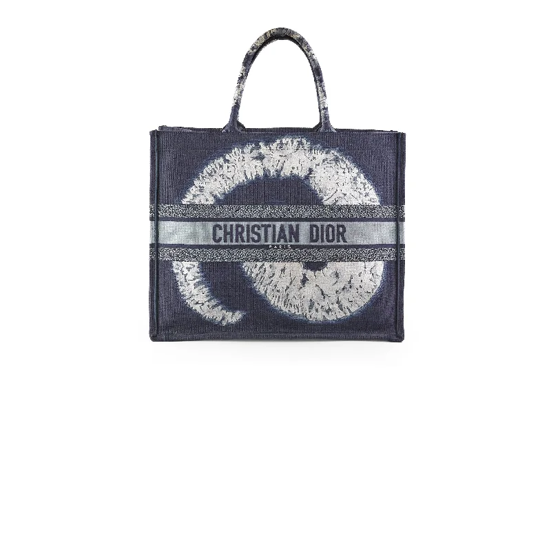 Contemporary Christian Dior handbags with a unique shapeChristian Dior Book Tote Large Blue Tie Dye